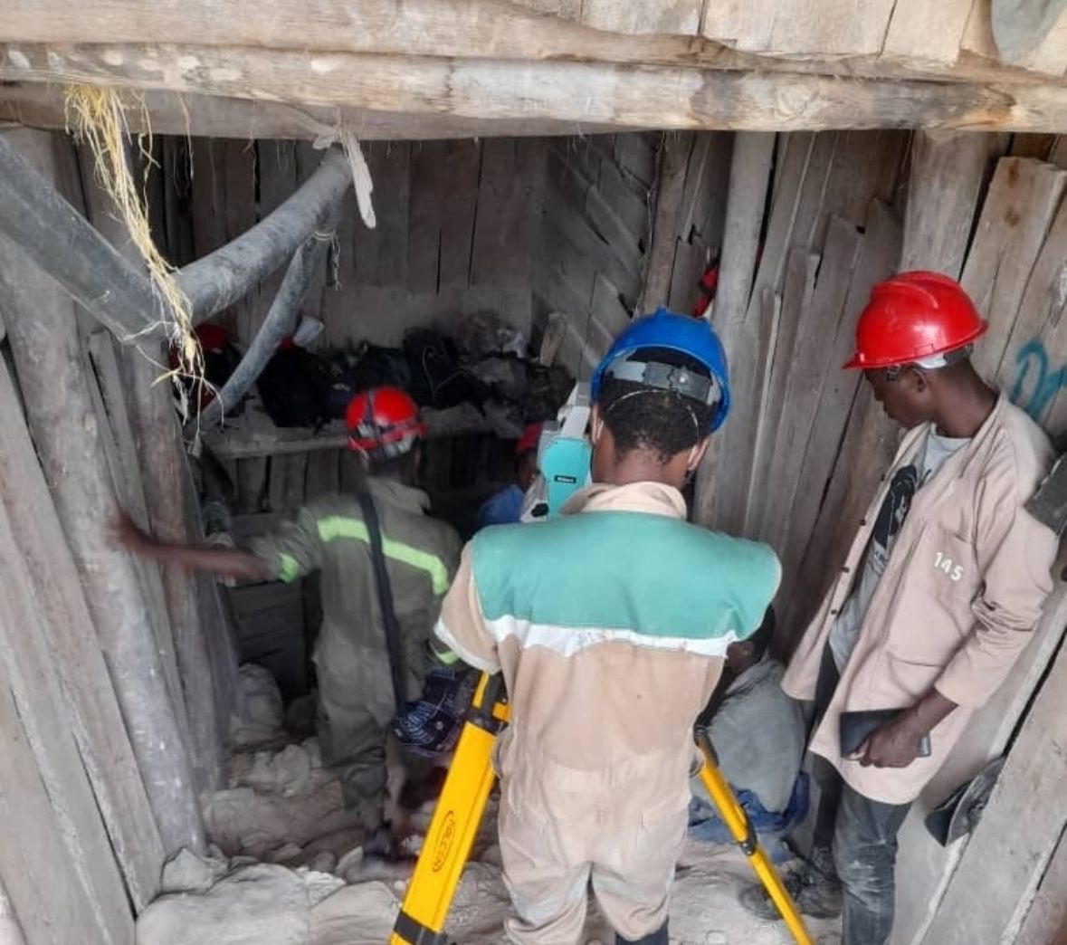 Surveyor measuring in mine shaft